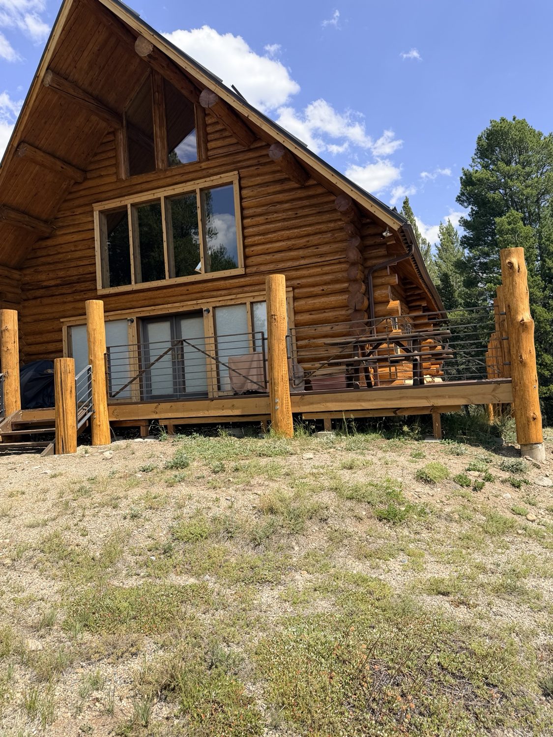 Custom log cabin deck railing by AR Custom Metal Works