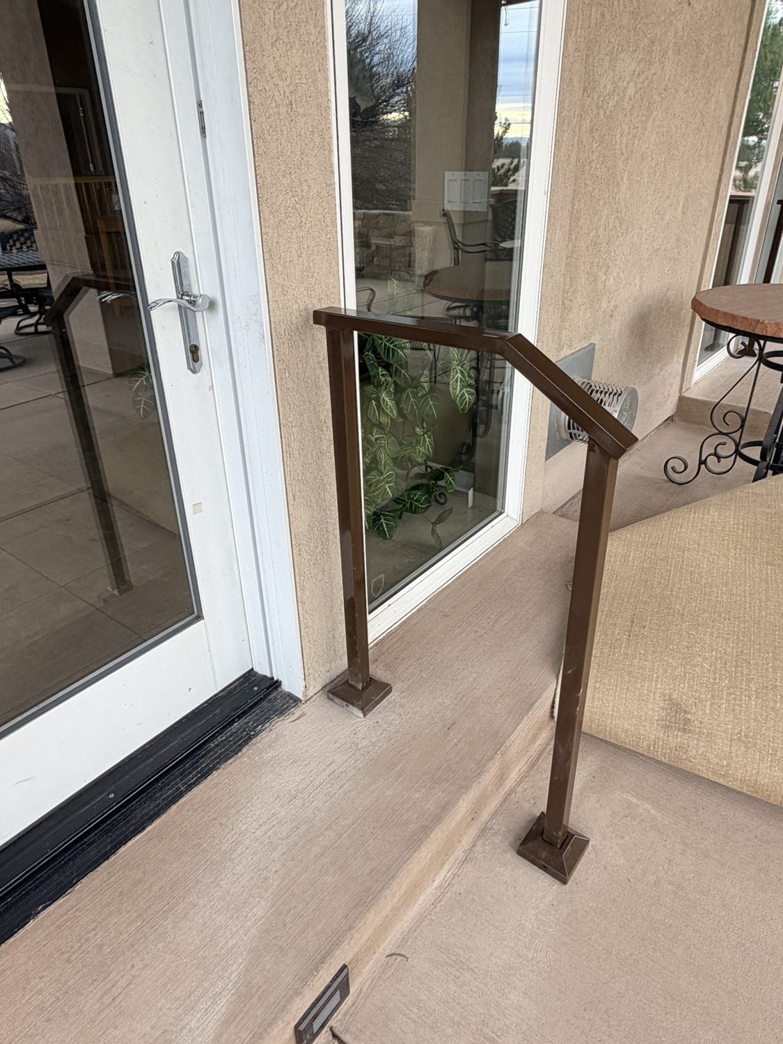 Bronze-finish custom outdoor handrail by AR Custom Metal Works