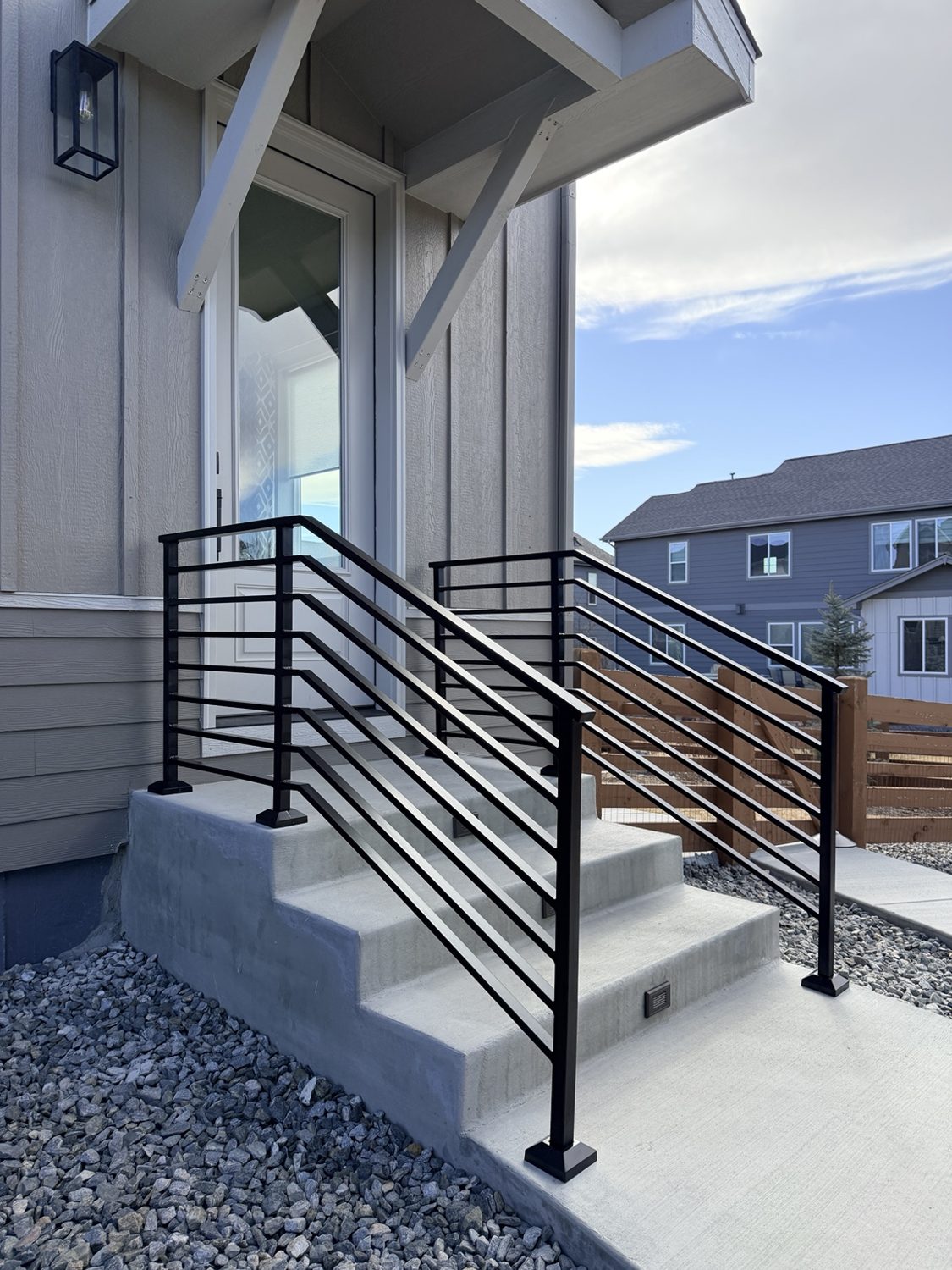 Modern black entry stair railings by AR Custom Metal Works