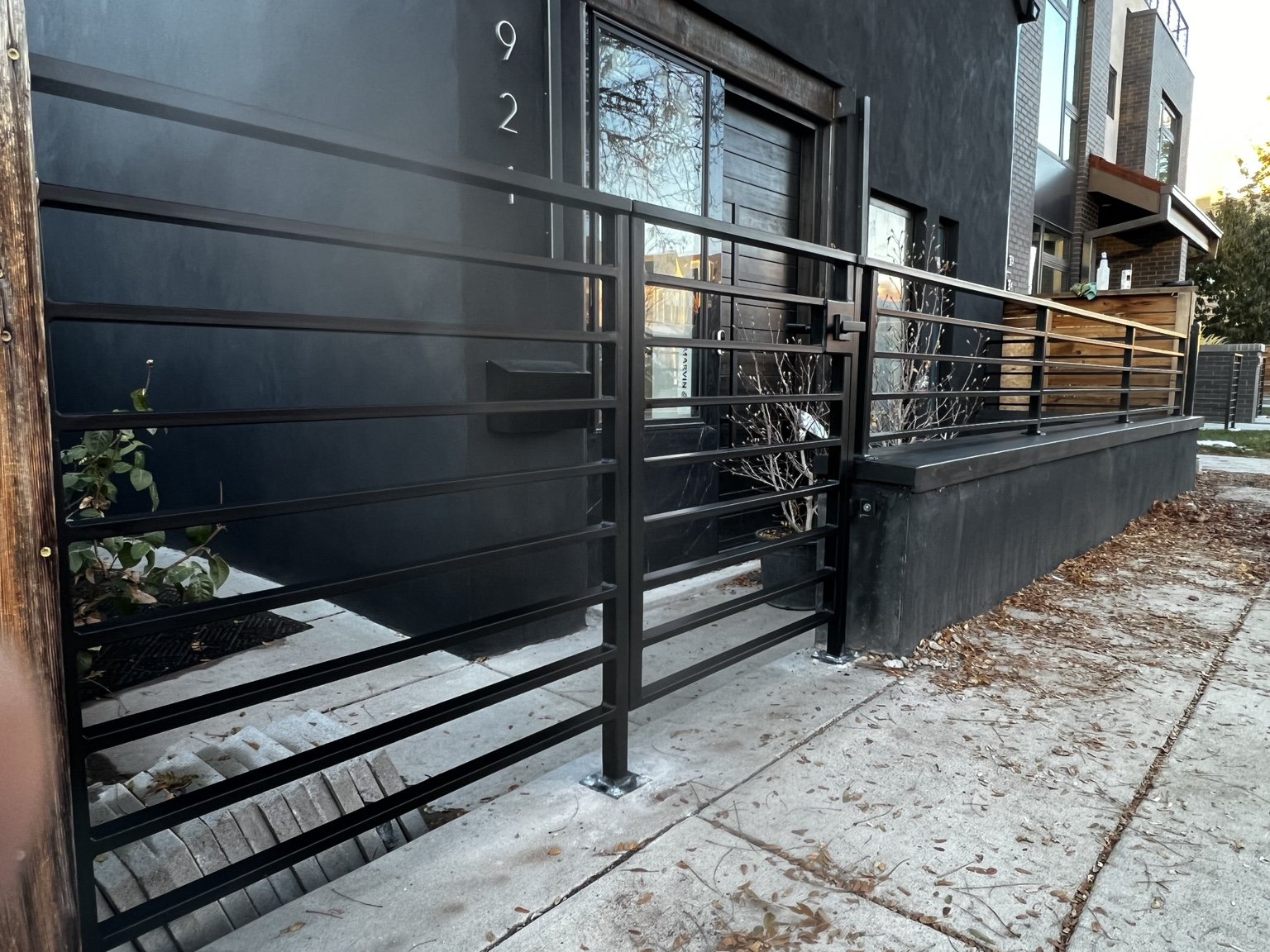 Contemporary steel fence and pedestrian gate by AR Custom Metal Works