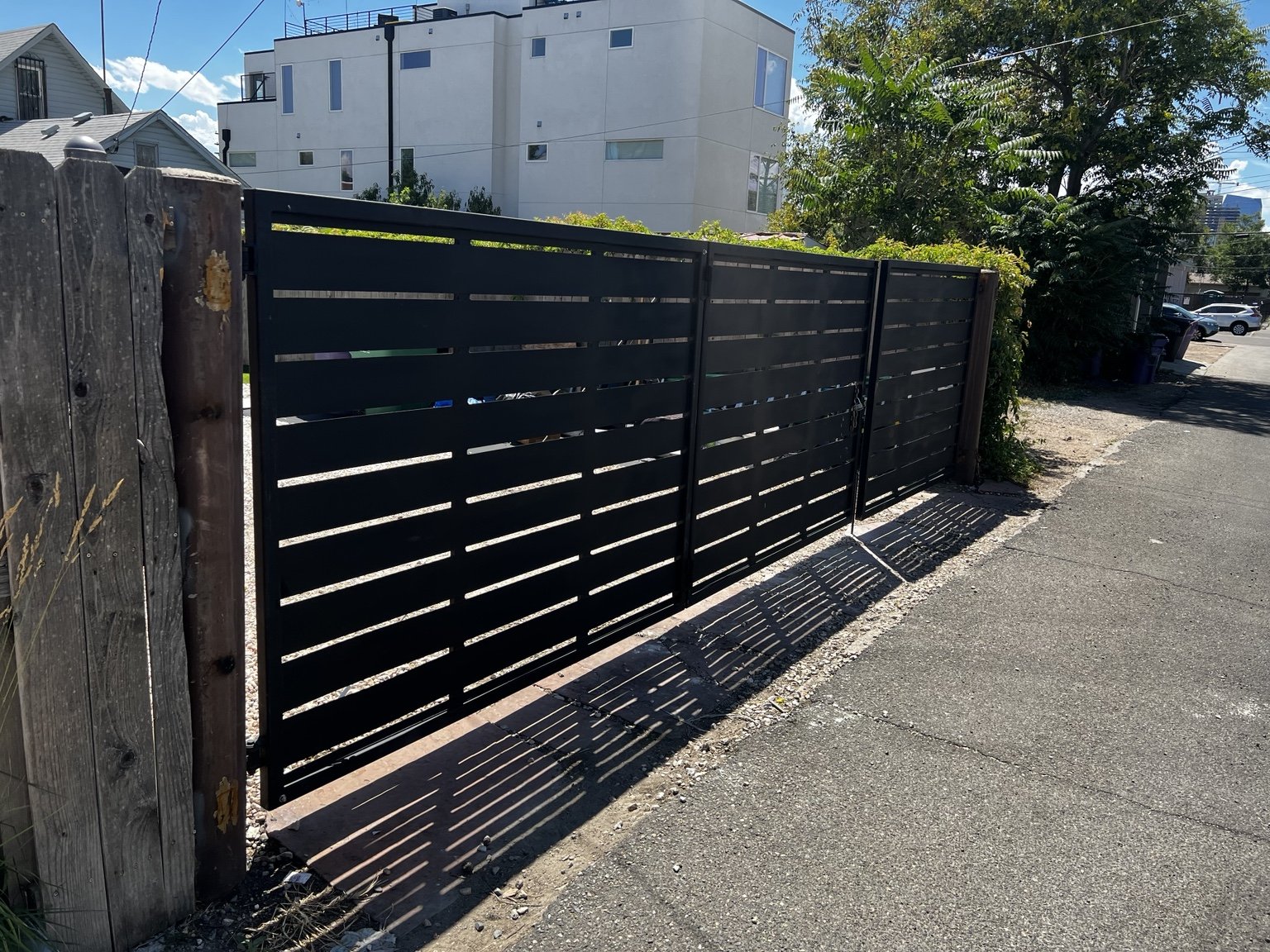 Modern horizontal steel driveway gate by AR Custom Metal Works