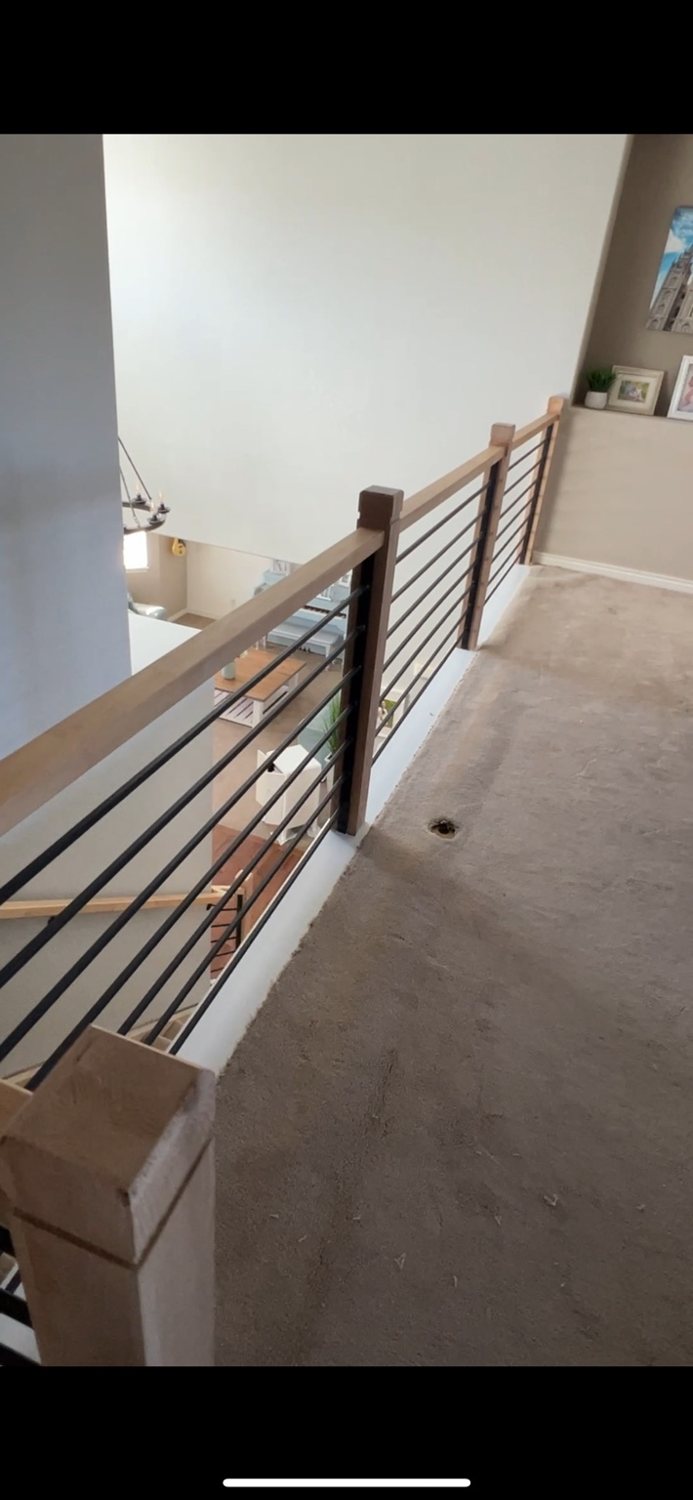 Custom horizontal railing with wood posts by AR Custom Metal Works
