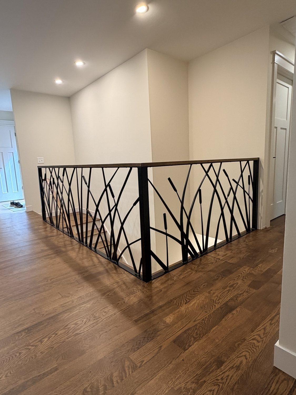Custom decorative branch-pattern railing by AR Custom Metal Works