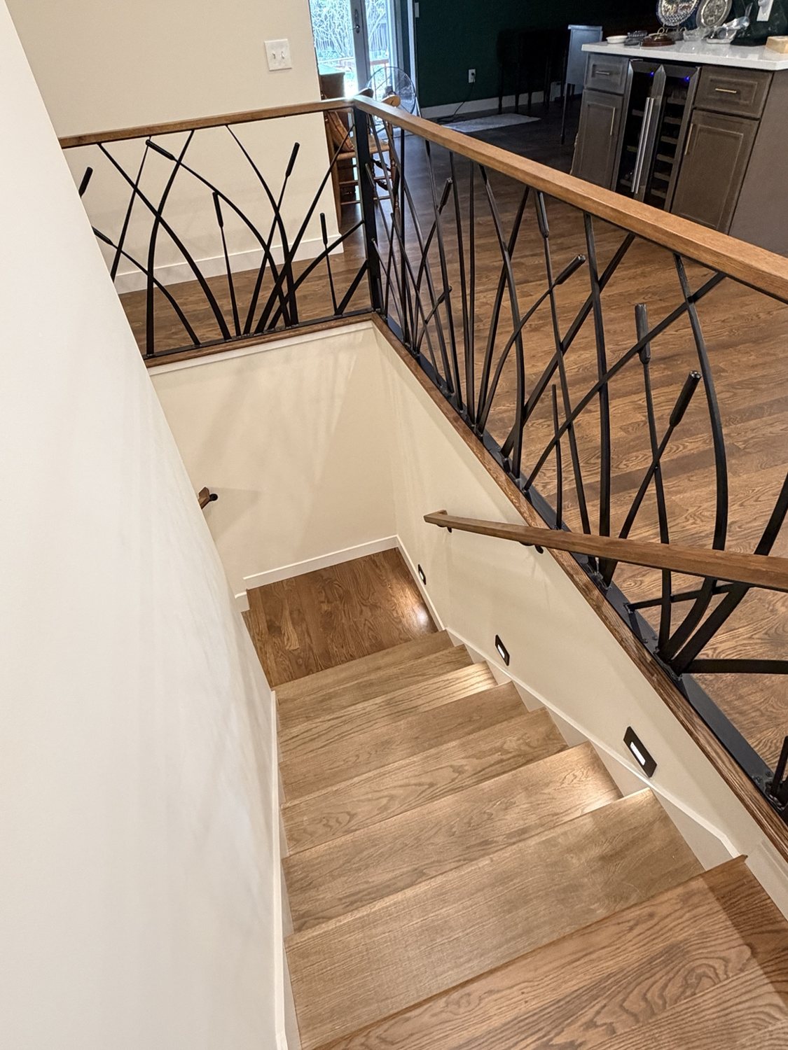 Artistic steel railing with wood top rail by AR Custom Metal Works