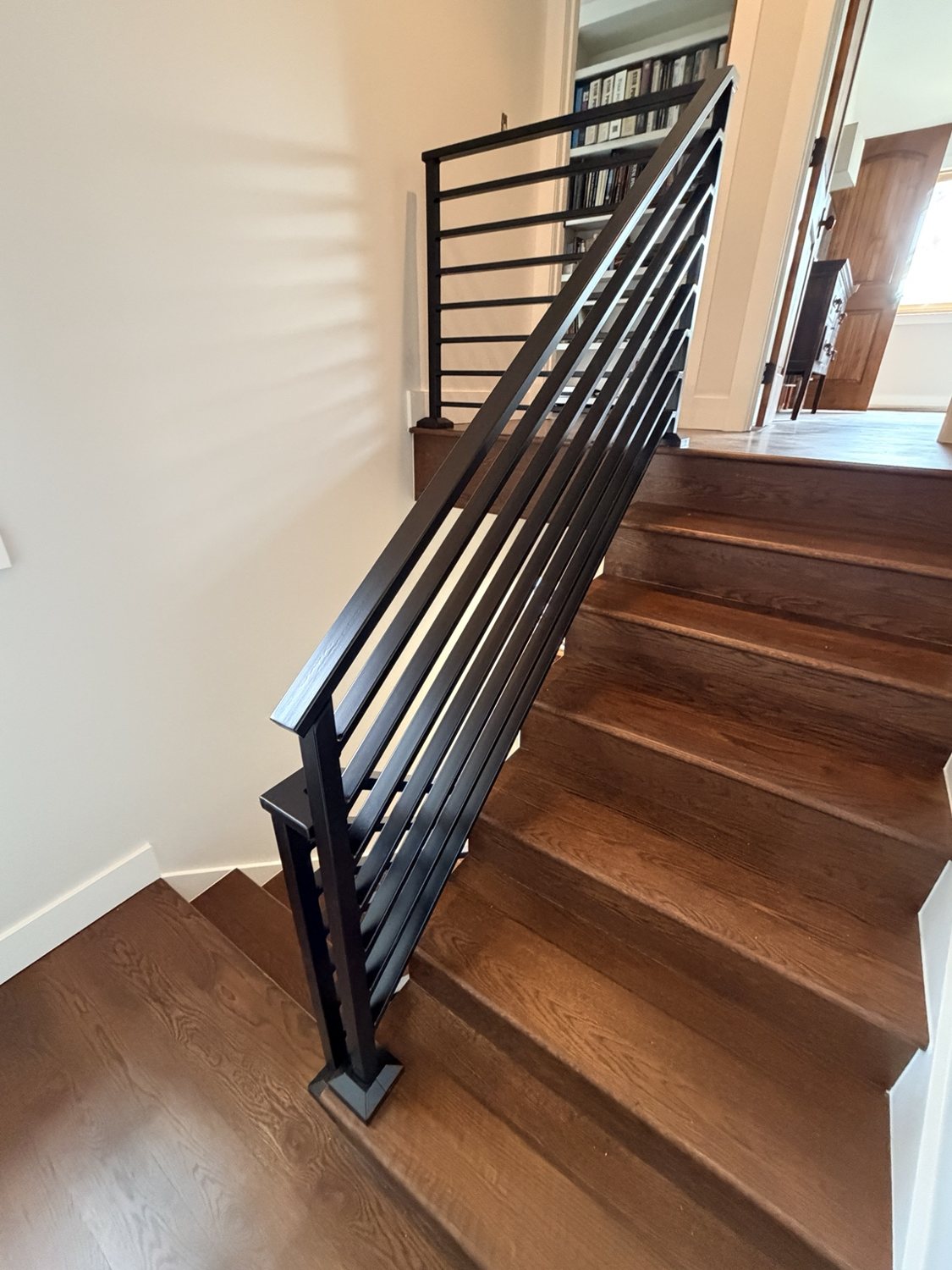 Modern horizontal steel stair railing by AR Custom Metal Works