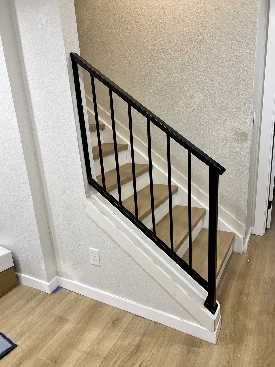 Minimalist black steel stair railing by AR Custom Metal Works