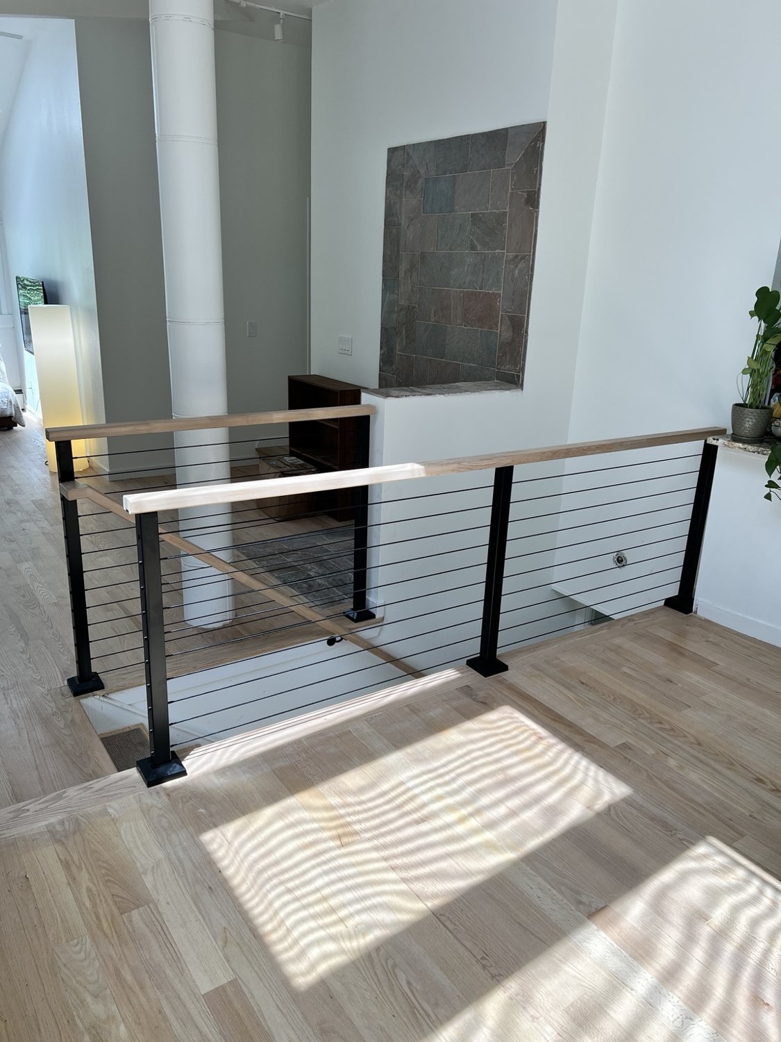 Black steel vertical picket railing by AR Custom Metal Works