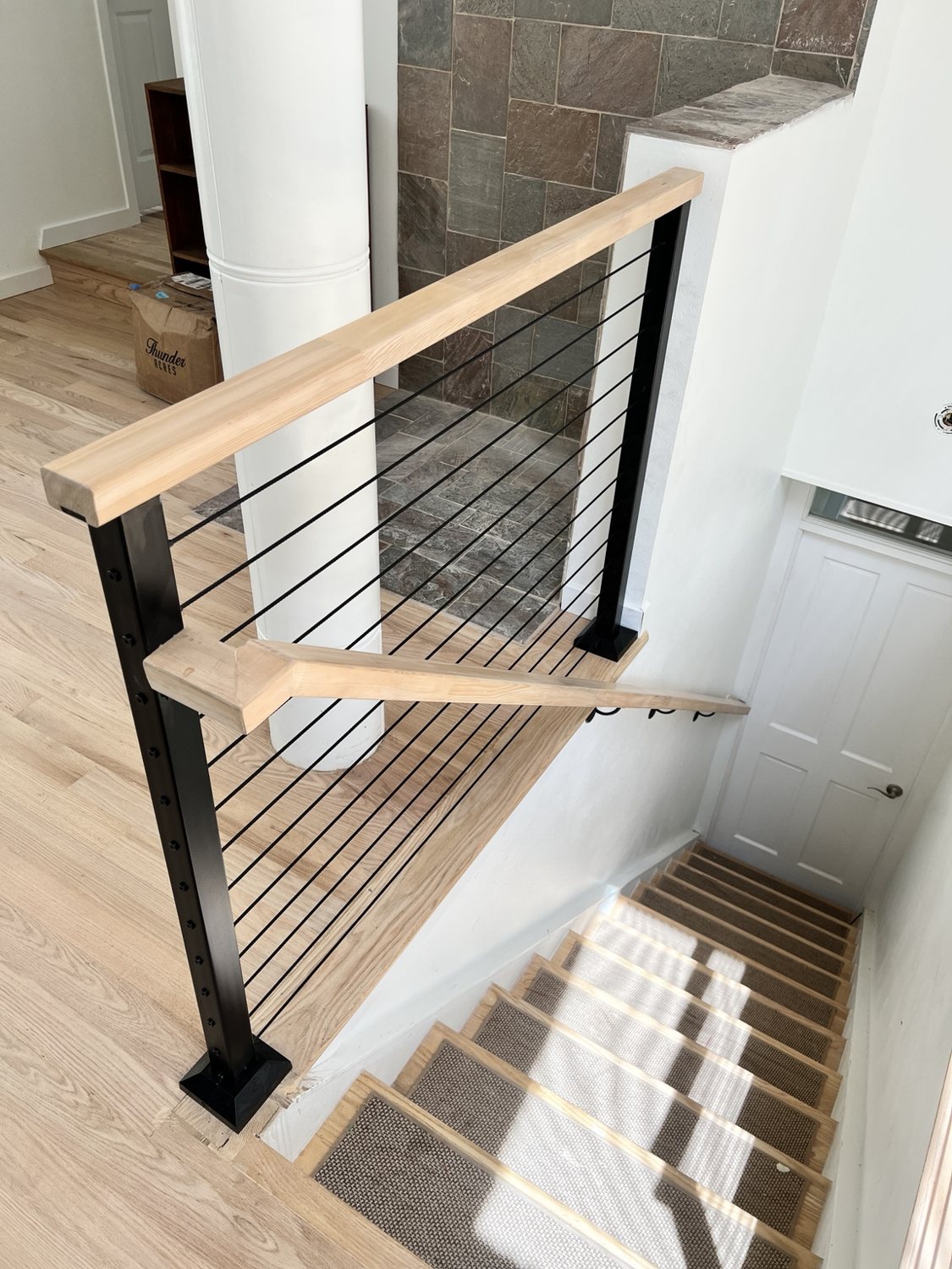 Cable railing with natural wood top rail by AR Custom Metal Works