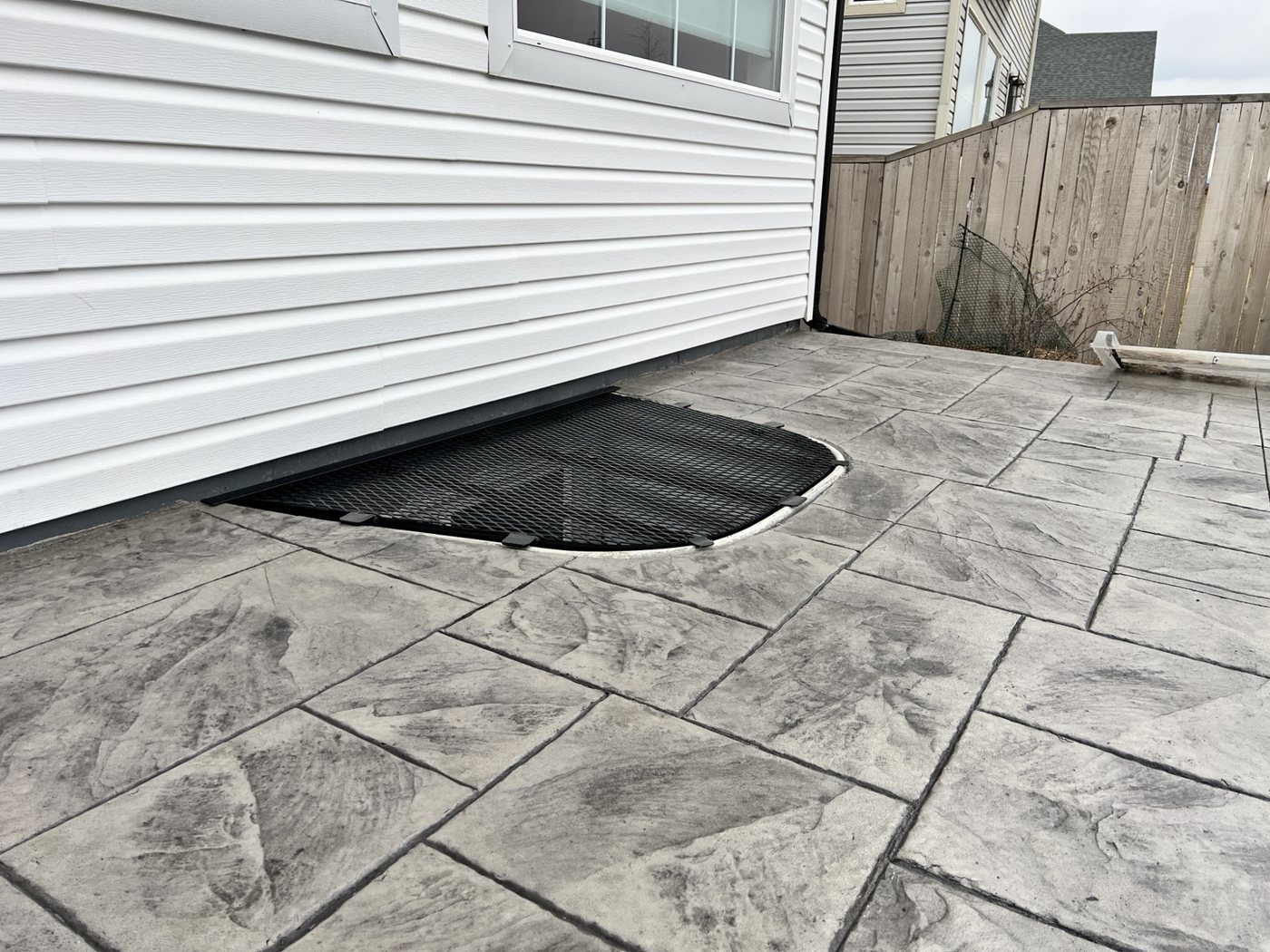 Flush-fit patio window well cover by AR Custom Metal Works