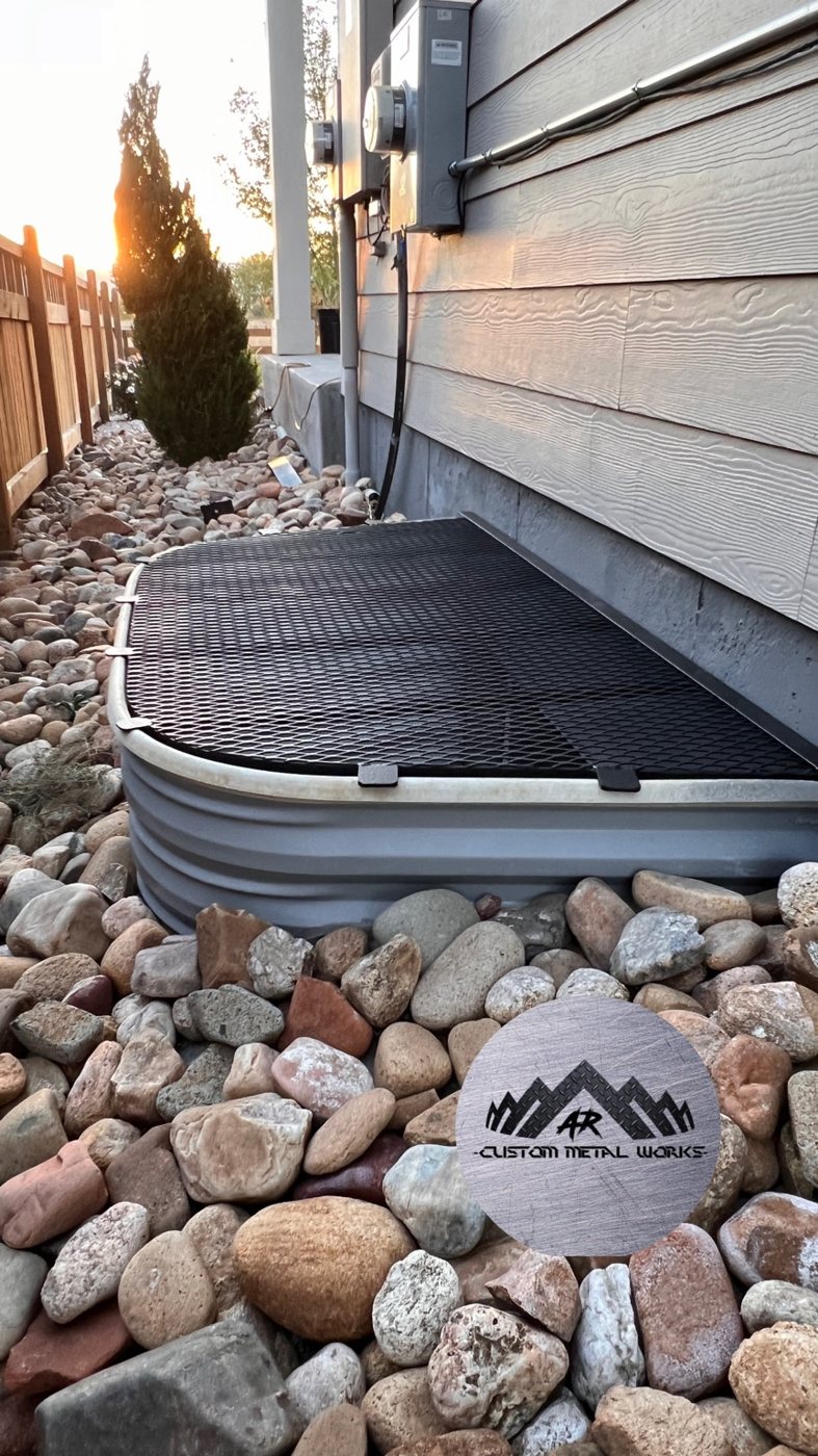 Installed window well cover by AR Custom Metal Works